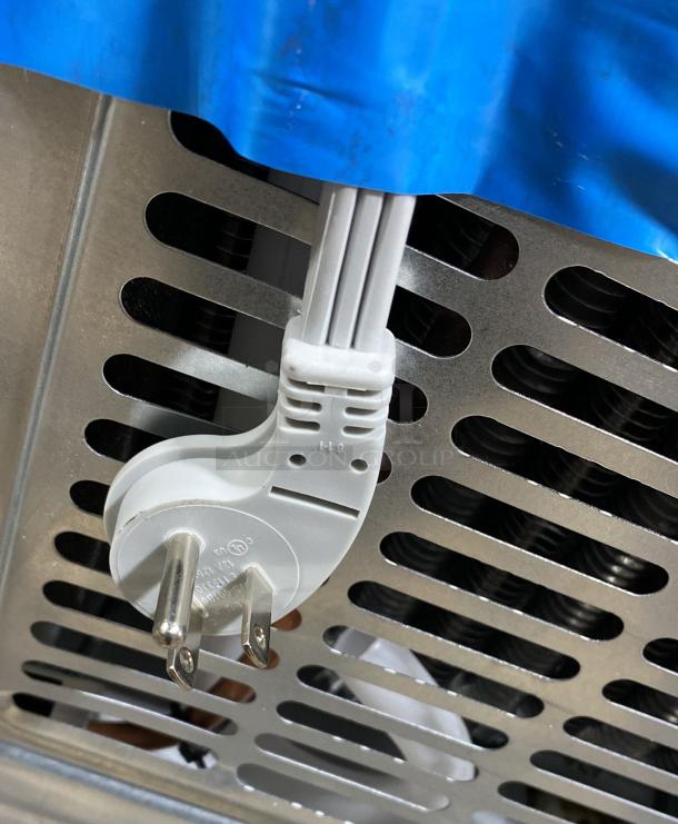 GE GSE25GYPFS side-by-side refrigerator plug and vent detail, new condition, stainless steel. External ice and water dispenser.