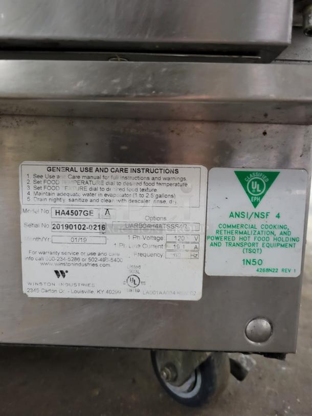 Winston CVap Holding Cabinet, model HA4507, stainless steel, serial 20190102-0216, care instructions visible, on castors.