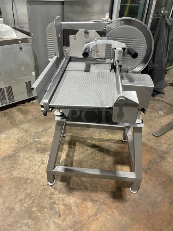 Jaccard VA2000GRT slicer on open base stand, electric-powered, 110V, stainless steel, used condition, with operating handles.