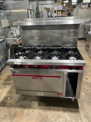 Vulcan stainless steel 8-burner range/oven combo with backsplash, overhead salamander shelf, storage, wired oven rack, on casters.
