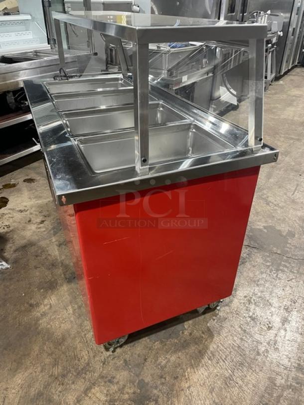 Delfield Shelleyglas Series red stainless steel 4-well cold food bar with sneeze guard, model KCSC60EF, on casters, 115V.