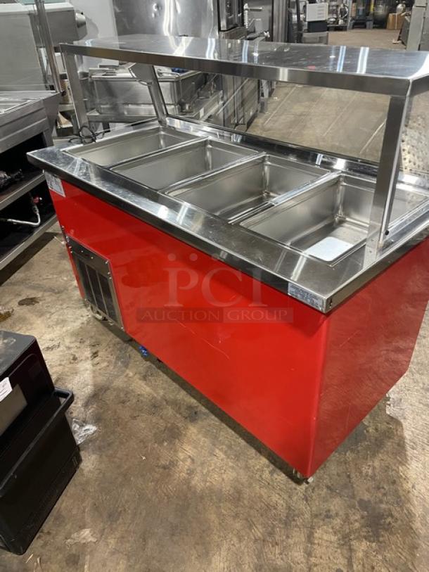 Delfield Shelleyglas Series red stainless steel 4-well cold food salad bar with serve-over sneeze guard, Model KCSC60EF.