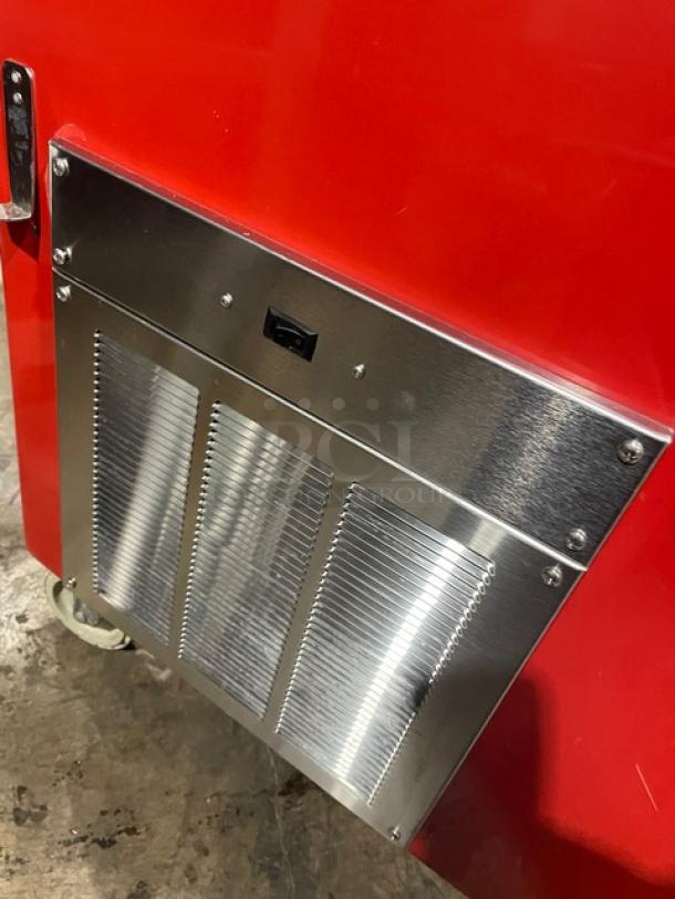 Delfield Shelleyglas red stainless steel 4-well cold food bar model KCSC60EF, with serve-over sneeze guard, on casters.