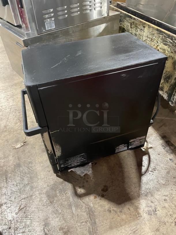 MerryChef Eikon E2S high-speed countertop oven in black, electric, 208/240V 1 phase, used condition with visible surface wear.