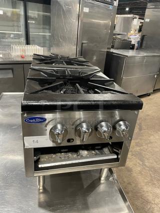 CookRite ATSP-18-2L commercial stainless steel double burner stock pot range, cast iron burners, gas-powered, on legs.