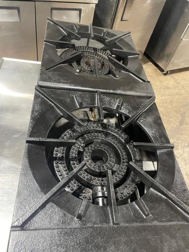 CookRite ATSP-18-2L stainless steel double burner range, natural gas, cast iron 3-ring burners, model on legs, used condition.