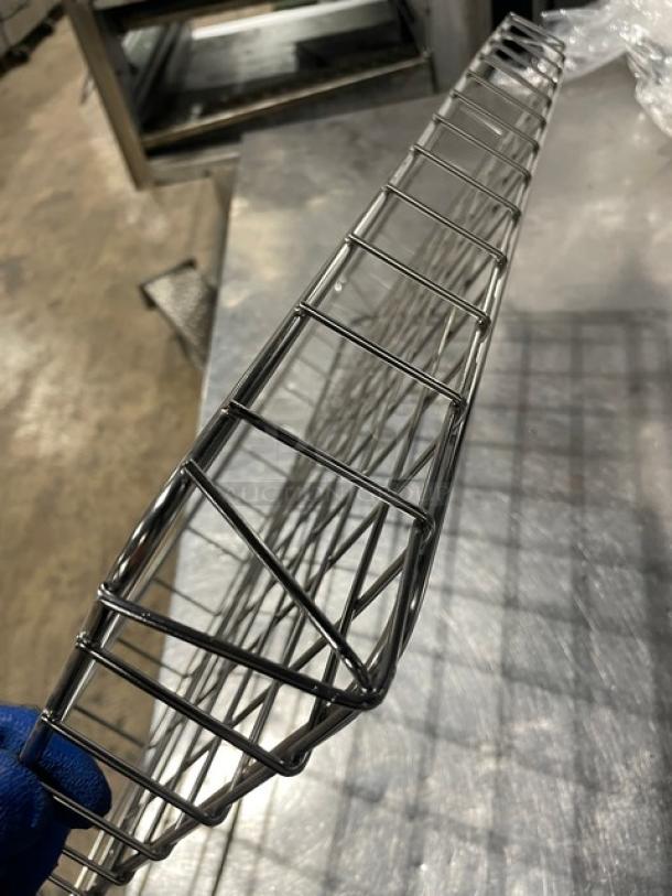 Commercial chrome-plated full-sized bagel/pastry wired rack in excellent condition, showcasing durable metal construction.