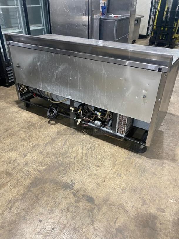 True TWT-72 commercial 3-door refrigerated worktop table, 72” stainless steel, upturned backsplash, on casters, 115V.