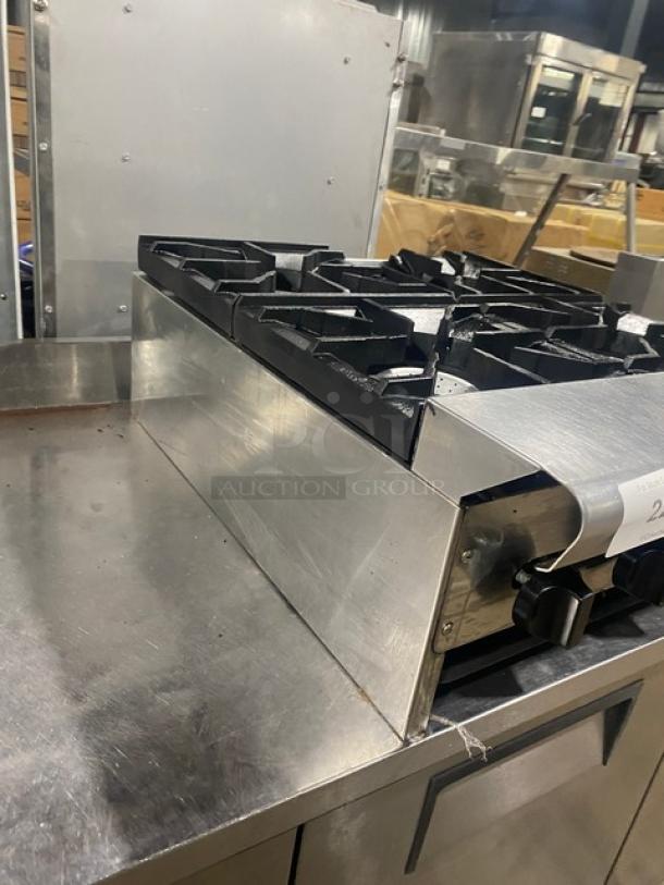 American Range commercial stainless steel 4-burner natural gas countertop range, in good condition, sturdy cast-iron grates.