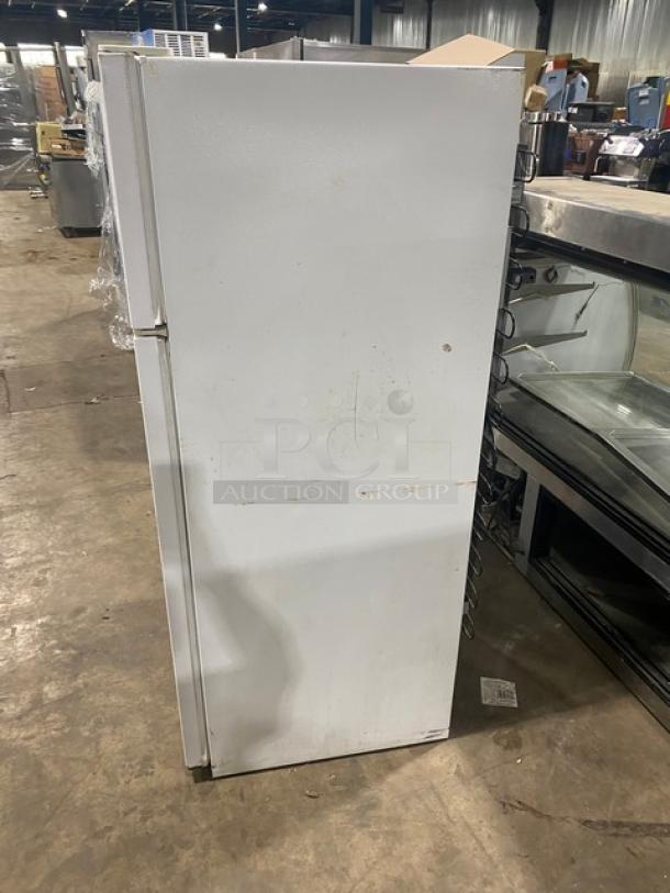 Frigidaire commercial white reach-in top freezer/refrigerator combo, model MRT18DNEW, with adjustable shelving, moderate wear.