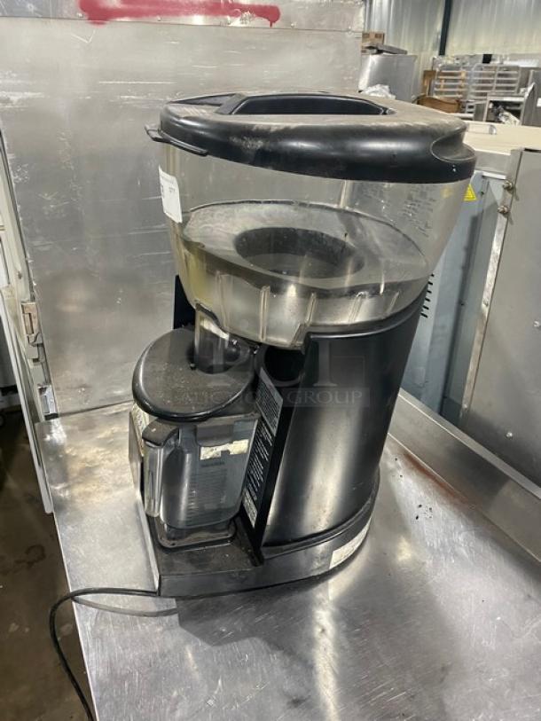 Vita-Mix VM0126 commercial blender with clear polycarbonate container, double insulated hopper, and on legs for stability.