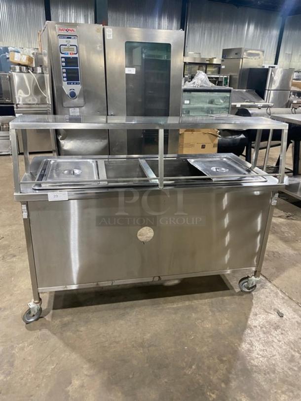 Atlas Metal stainless steel electric 4-well hot food table with sneeze guard, on casters; used condition.