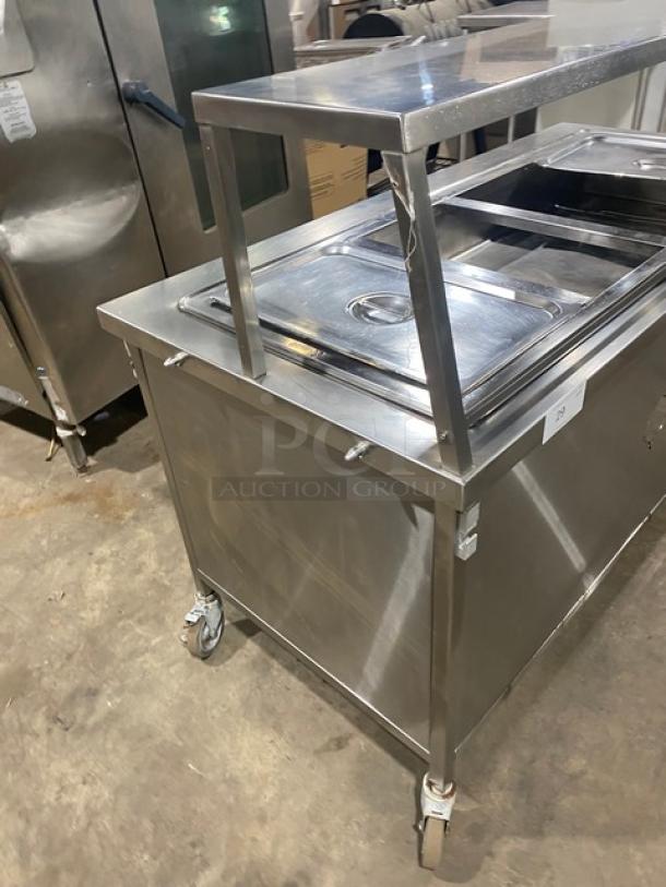Atlas Metal commercial stainless steel 4-well steam table with sneeze guard, electric, on casters, excellent condition.