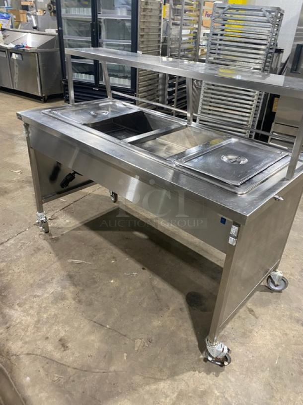 Atlas Metal stainless steel electric 4-well hot food steam table with sneeze guard, on casters, excellent condition.