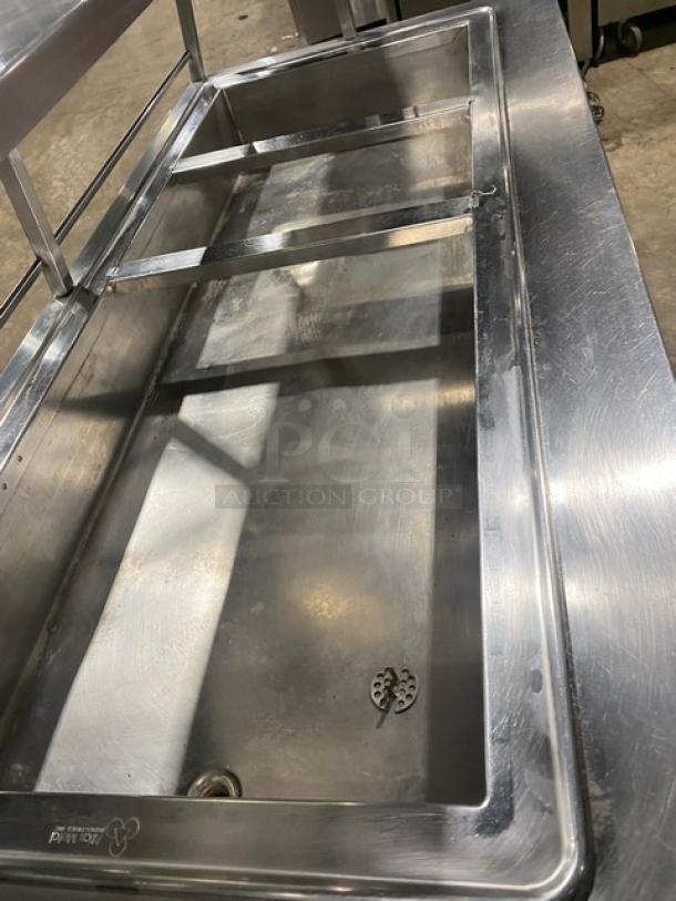 Atlas Metal stainless steel electric 4-well hot food table, features sneeze guard, casters, shows good condition.