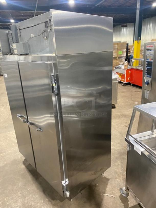 McCall stainless steel double door reach-in freezer, model 1-1045F. Features durable construction, 115V, 1 phase, on legs, in used condition.