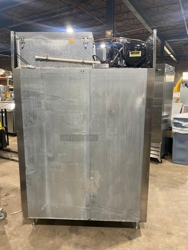 McCall stainless steel double door reach-in freezer, model 11045F, on legs, with visible compressor.