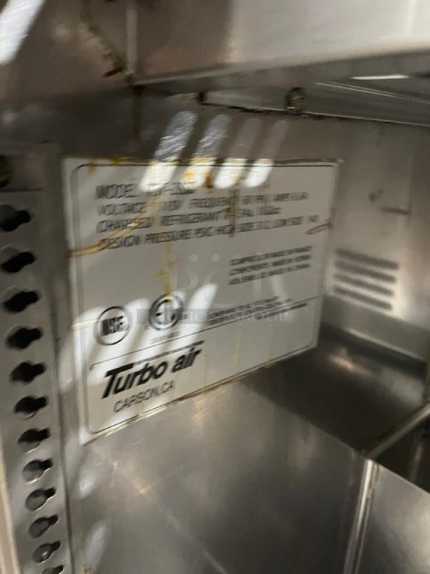 Turbo Air TST-28SD stainless steel refrigerated salad/sandwich prep table with cutting board, 115V 1 phase, on casters.