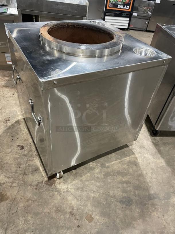 Commercial stainless steel Indian-style tandoor oven on casters. Natural gas/charcoal powered. Used condition.