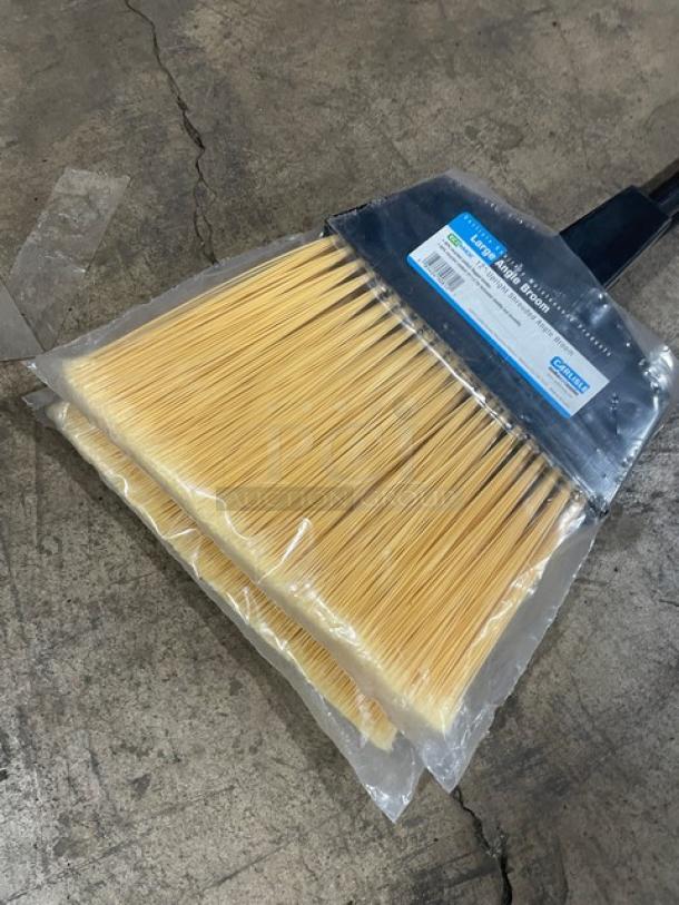 New Carlisle 12" Upright Shrouded Angle Broom with black grip handle, packaged. Model info visible.
