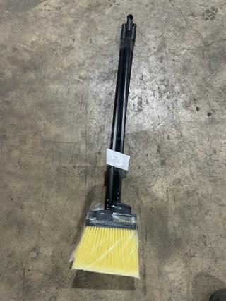 New commercial floor broom with black grip handle, yellow bristles; wrapped, labeled "37X."; pristine condition.