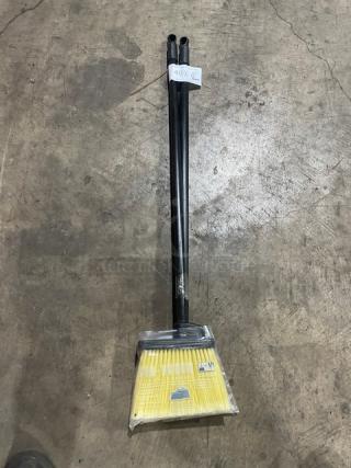 New commercial floor broom with black grip handle. Includes two brooms per bid. Yellow bristles, unused condition.
