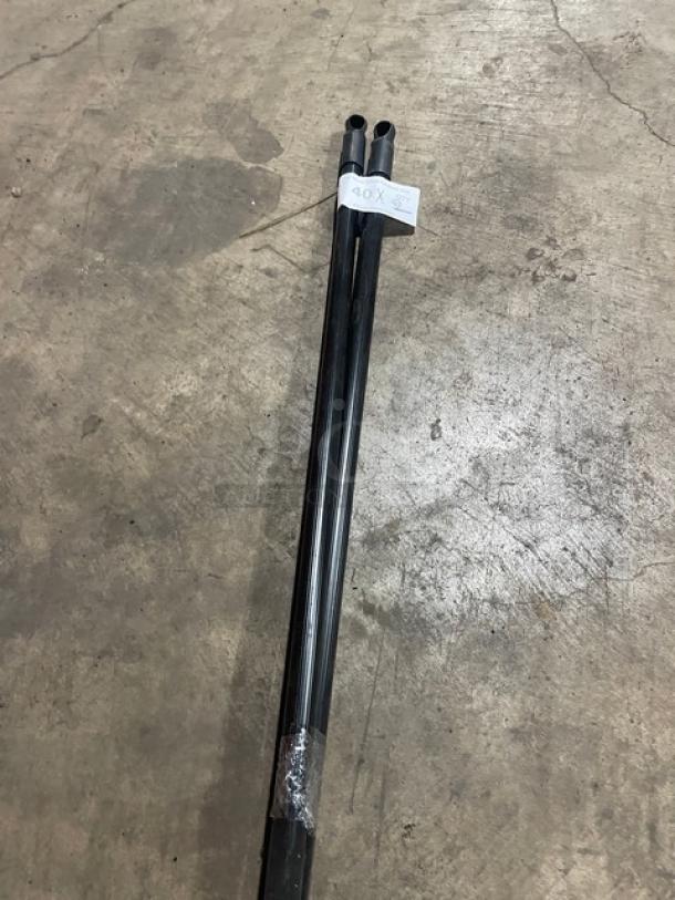 New commercial floor broom with black grip handle, wrapped in plastic. Tag indicates "40X." New condition.