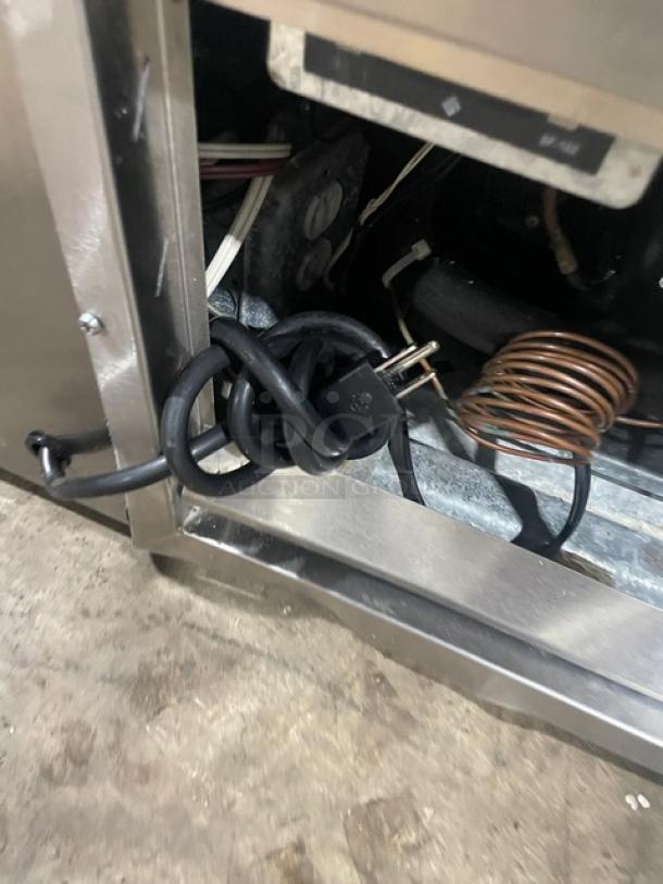 Stainless steel 48" refrigerated bakery display case, Model CBK48SC by Leader. Visible power cord and internal coils.