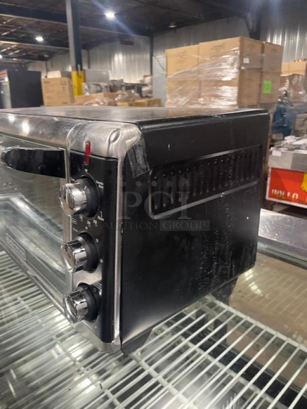 BLACK+DECKER TO3250XSB toaster oven, stainless steel, extra-wide convection, countertop model, on legs, 120V, commercial use.