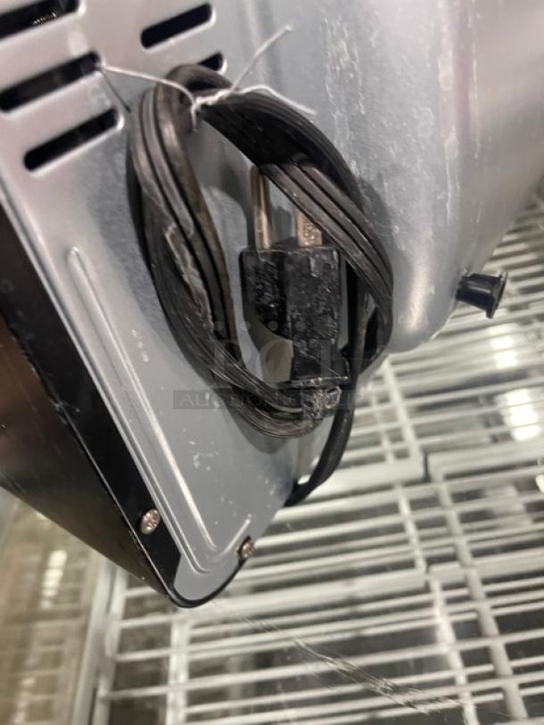 BLACK+DECKER TO3250XSB convection toaster oven plug and power cord. Model on metal frame, slight wear visible.