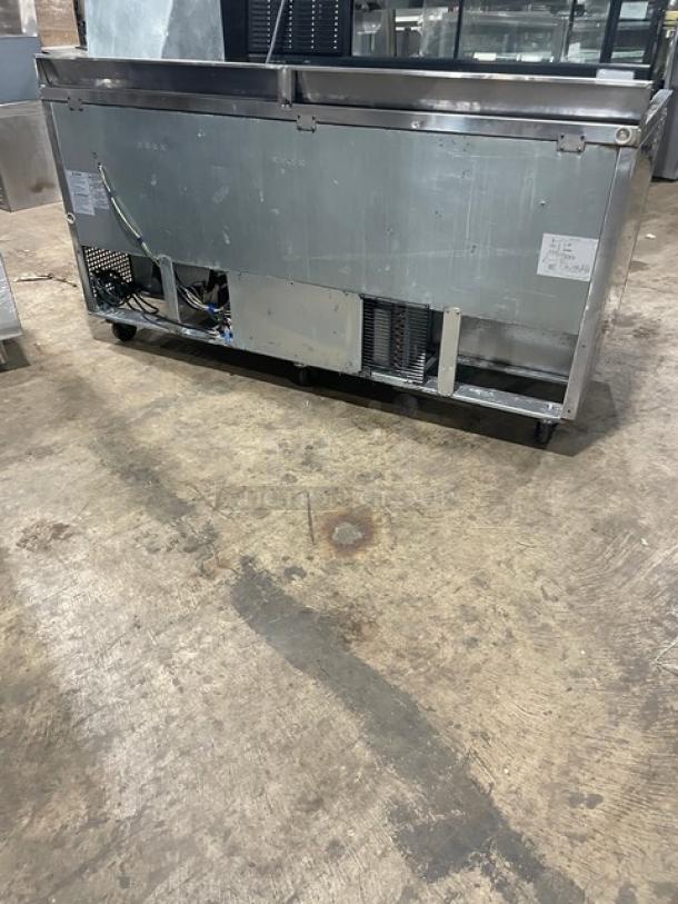 Turbo Air Super Deluxe 3-Door Refrigerator, Model TWR72SDN, stainless steel, 72” worktop, 3.5” backsplash, on casters, backside view.