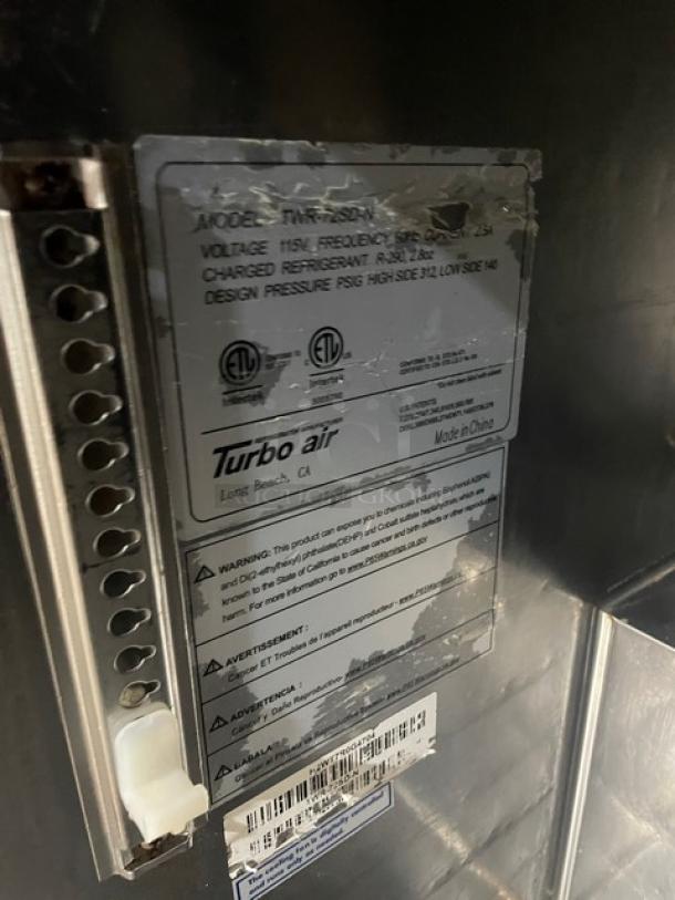 Turbo Air stainless steel 3-door worktop refrigerator, model TWR-72SD-N, with 3.5” backsplash, on casters.