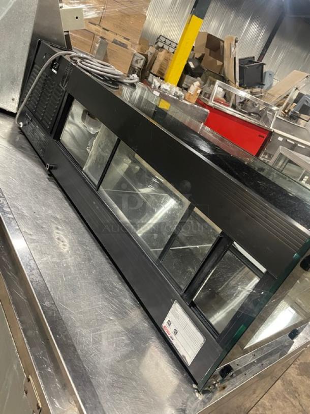 Turbo Air black refrigerated countertop sushi merchandiser with rear sliding doors. Features glass display, excellent condition.