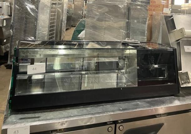 Turbo Air commercial sushi display case, black, countertop model with rear sliding doors, excellent condition.