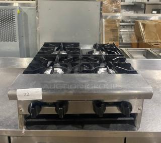 American Range stainless steel, natural gas 4-burner countertop range in good condition with control knobs and grate.