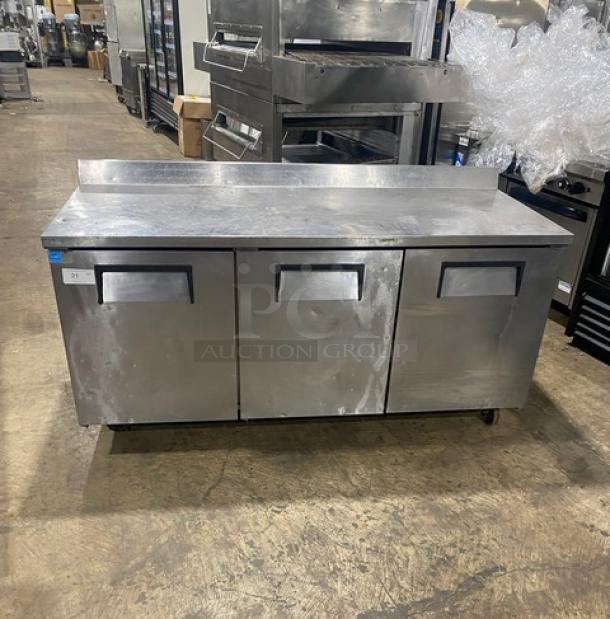 True Commercial Stainless Steel 3-Door Refrigerated Worktop Table, Model TWT-72, Energy Star, with Upturned Back Splash, on Casters.