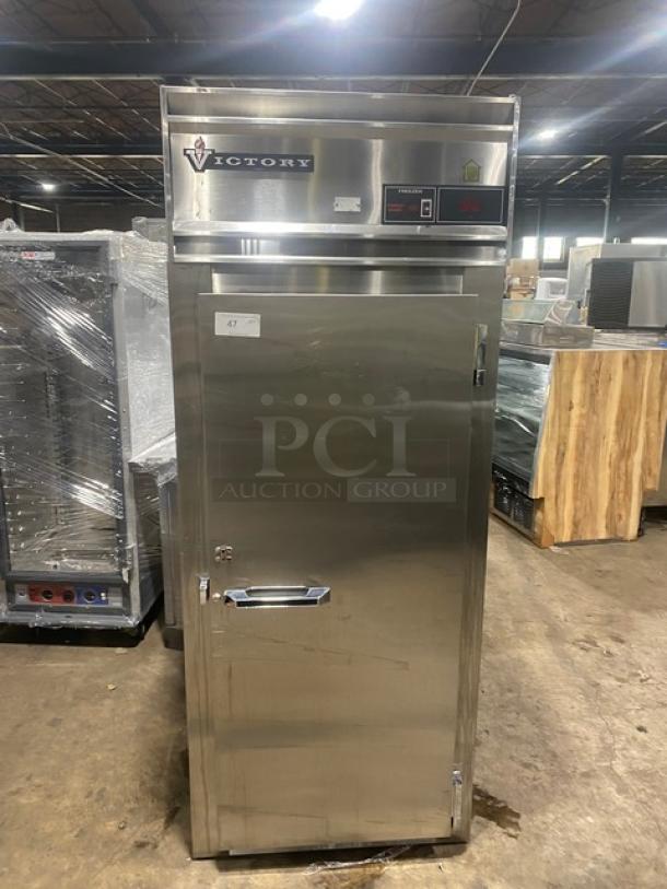 Victory commercial stainless steel single door reach-in freezer with legs, solid condition, model features visible on top.