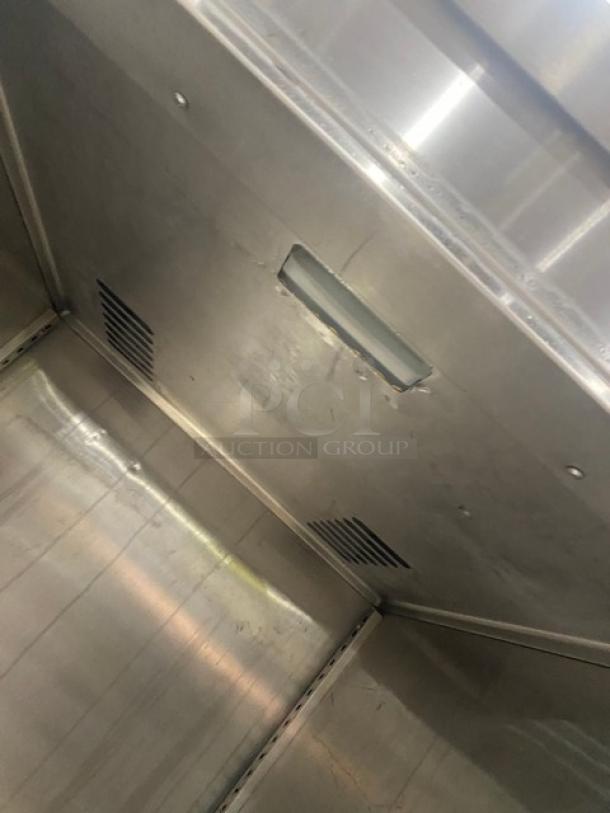 Victory commercial stainless steel reach-in freezer interior, solid single door, includes legs, vents visible, clean condition.