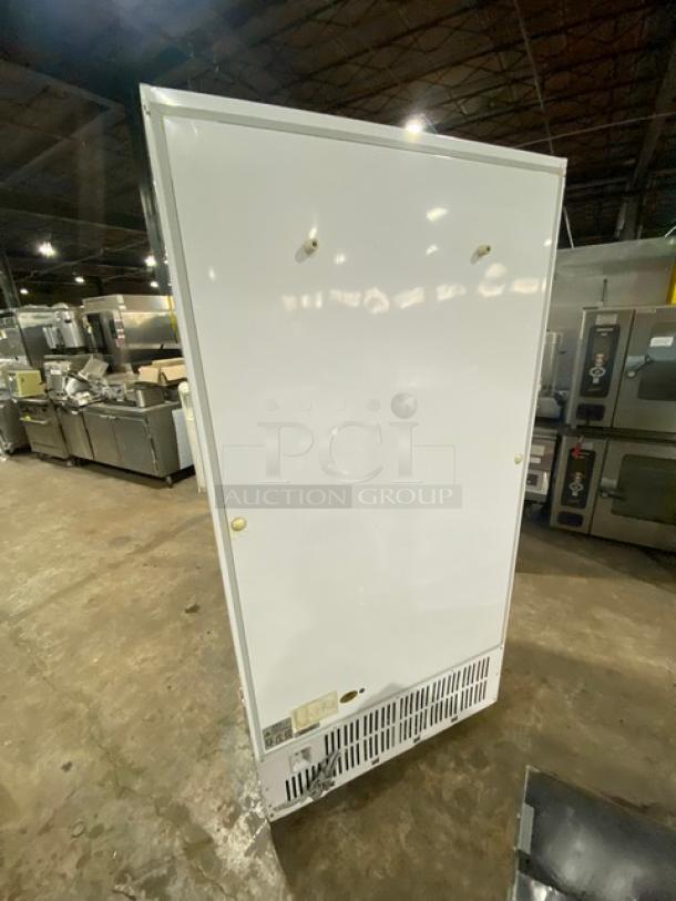 Commercial white double glass swing-door reach-in merchandiser refrigerator, model LG-800BF. Poly coated wire racks, 220V.