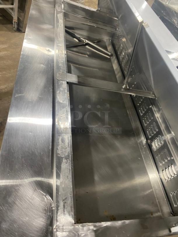 Avantco APT-71M-HC stainless steel 3-door refrigerated prep table, mega top, on casters, visible interior compartments.