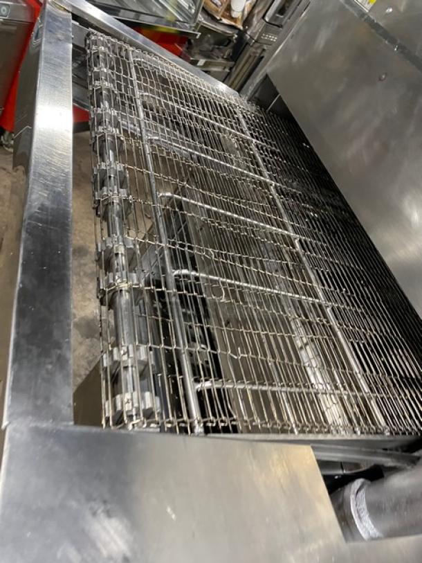 Middleby Marshall stainless steel double-stacked conveyor pizza oven, electric powered, on casters, commercial-grade.