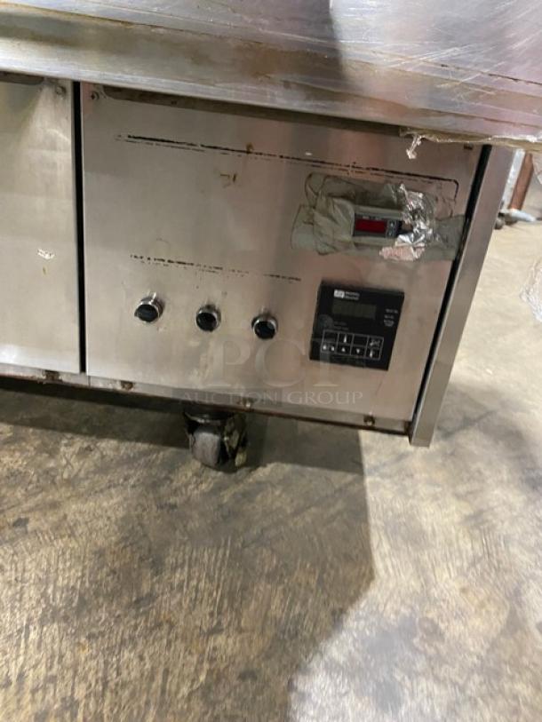 Middleby Marshall stainless steel double-stacked conveyor pizza oven on casters, electric-powered, showing control panel detail.