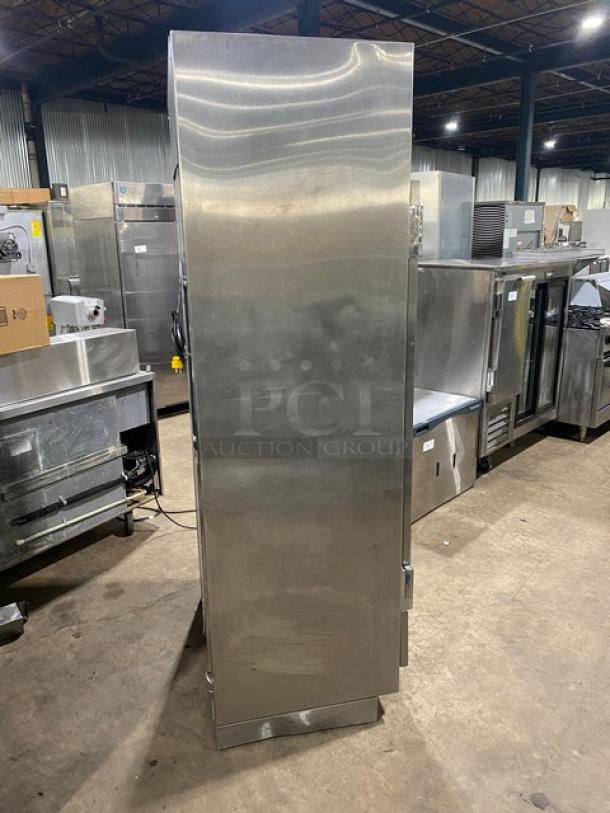 Traulsen URS36DT stainless steel refrigerator/freezer combo with chrome wire racks; space-saving design, SN: M845670 5N.
