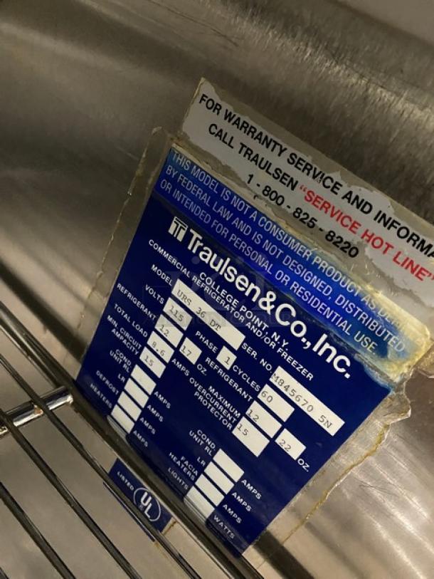 Traulsen URS36DT commercial refrigerator/freezer combo with chrome racks, model/serial tag visible, 115V 1 Phase.