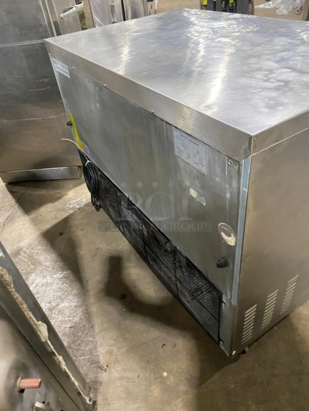 Entree stainless steel 2-door undercounter worktop refrigerator, Model UR48Q, Energy Star certified, on casters.