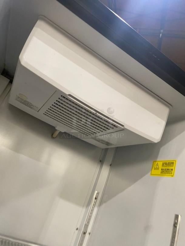 Kool-It LX24R merchandiser refrigerator interior view, poly coated wire racks, 115V, single glass swing door, on casters.