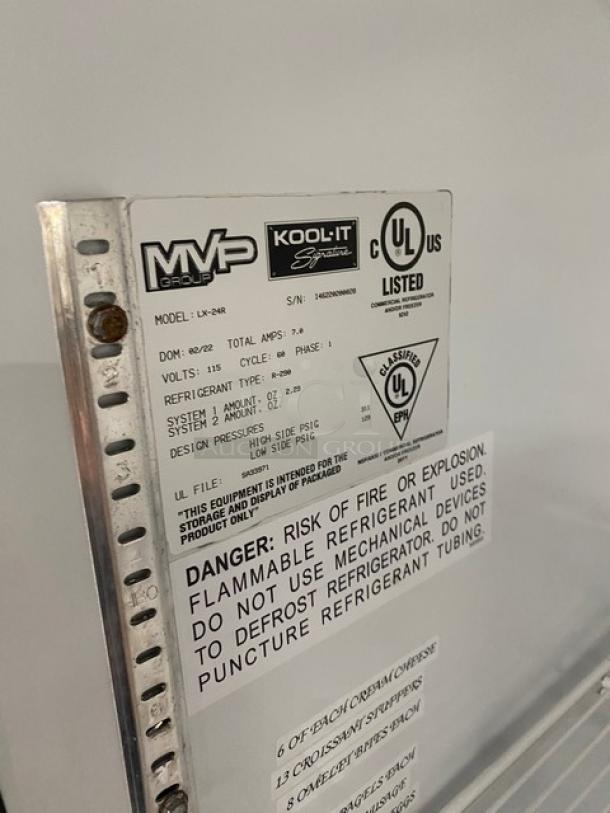 Kool-It LX-24R merchandiser refrigerator label and warnings. Model info, serial number, and safety instructions visible.