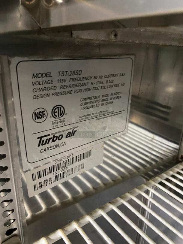 Turbo Air Super Deluxe TST-28SD refrigerated prep table, 115V, stainless steel, poly-coated wire rack, on casters, NSF and ETL certified.
