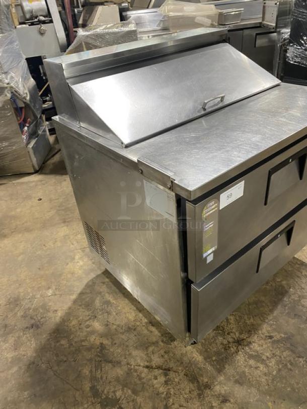 Everest stainless steel 2-drawer refrigerated salad/sandwich prep table on casters. Durable construction, commercial use.