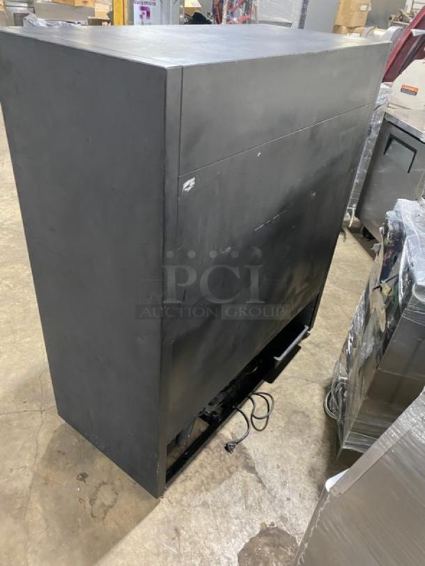 True GDM-41SL-54 commercial black refrigerator, double glass sliding doors, poly coated wire racks, 115V, 1 phase.